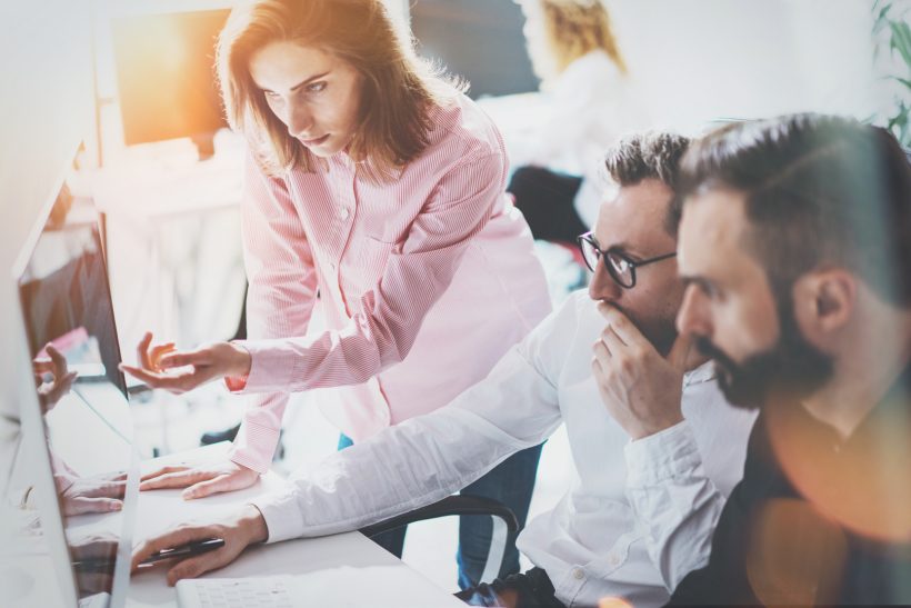 Coworkers Business Meeting Process Sunny Modern Office.Teamwork Concept.Group Young People Discussing Together Startup Idea.Businessman Team Working Online Project Desktop.Blurred Background