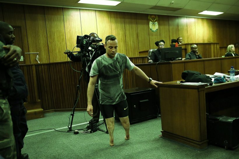 epa05366635 South African Paralympian Oscar Pistorius (C) walks without his prosthetic legs in the courtroom during proceedings on the third day of his sentencing hearing at the High Court in Pretoria, South Africa, 15 June 2016. The Supreme Court of South Africa overturned the High Court's verdict in December 2015, with the South African Paralympian Oscar Pistorius now facing a sentencing for murder of his girlfriend Reeva Steenkamp on 13 February 2013.  EPA/ALON SKUY / POOL