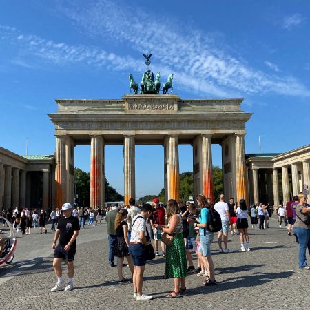 People walk in front of the Brandenburg Gate after Last Generation ("Letzte Generation") climate activists threw paint on the columns of the Brandenburg Gate in Berlin, Germany, September 17, 2023. REUTERS/Swantje Stein